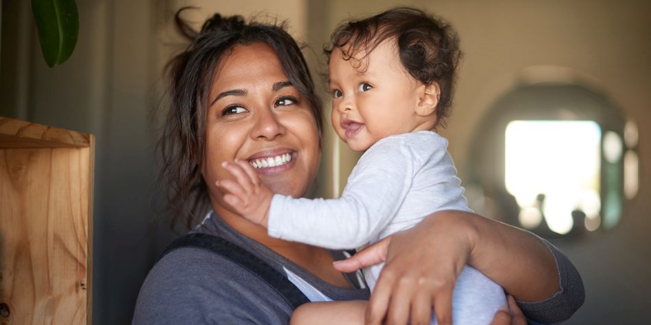 Woman holding young baby